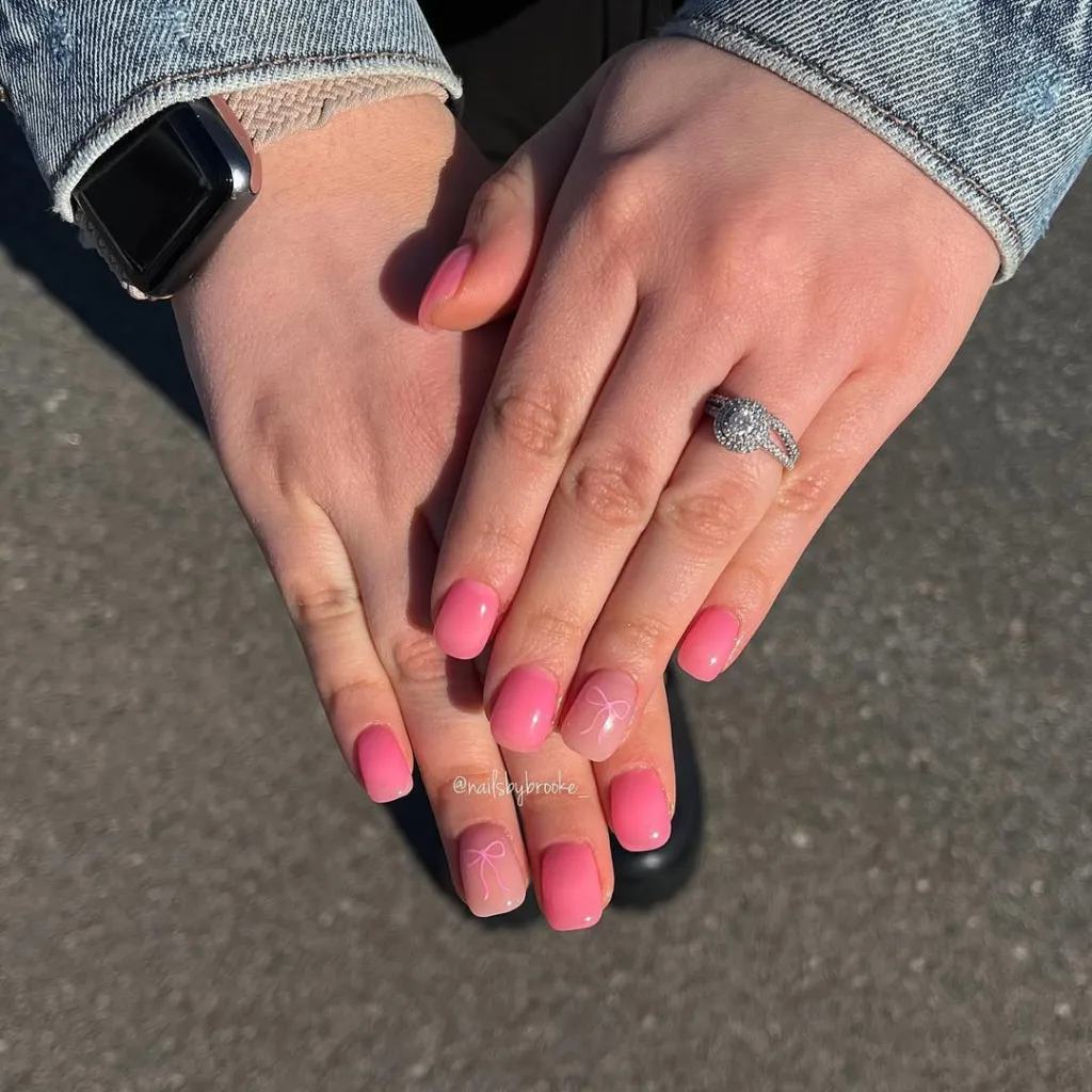 Ombre rosa Nägel mit Bogendesigns, perfekt für Frühlingspicknicks und Brunchs.